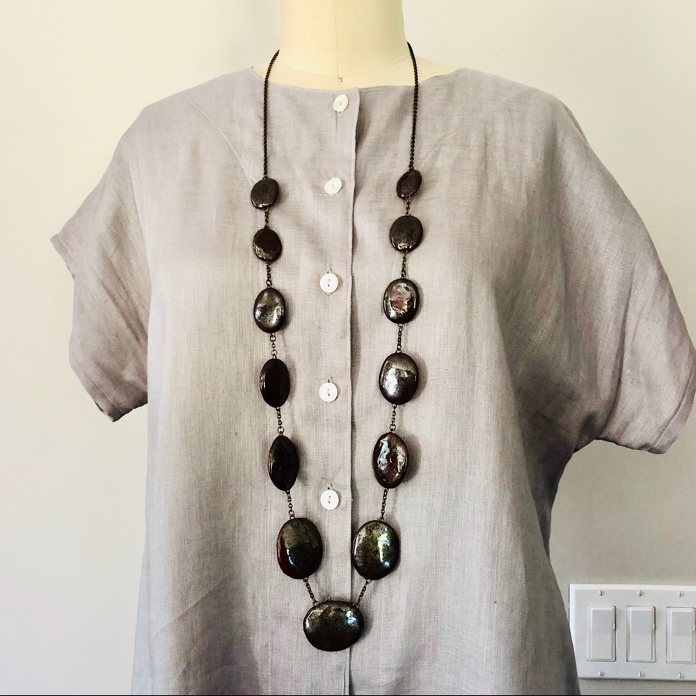 Ceramic brass chain link necklace.